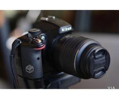 Nikon D5100 + grip + lente 18-55mm